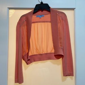 Orange silk sweater.